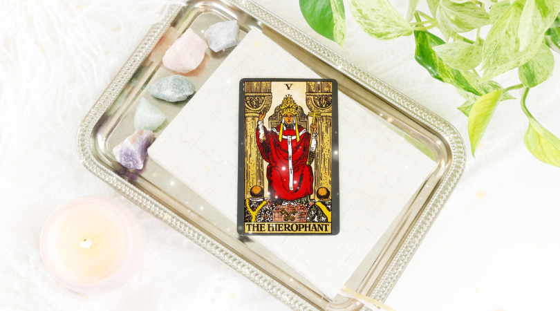 The Hierophant tarot card represents a spiritual teacher who leads by example. They serve the highest good of the community, and encourage others to live by rules that benefit everyone. Their ethereal wisdom is passed on and traditions are born from it.